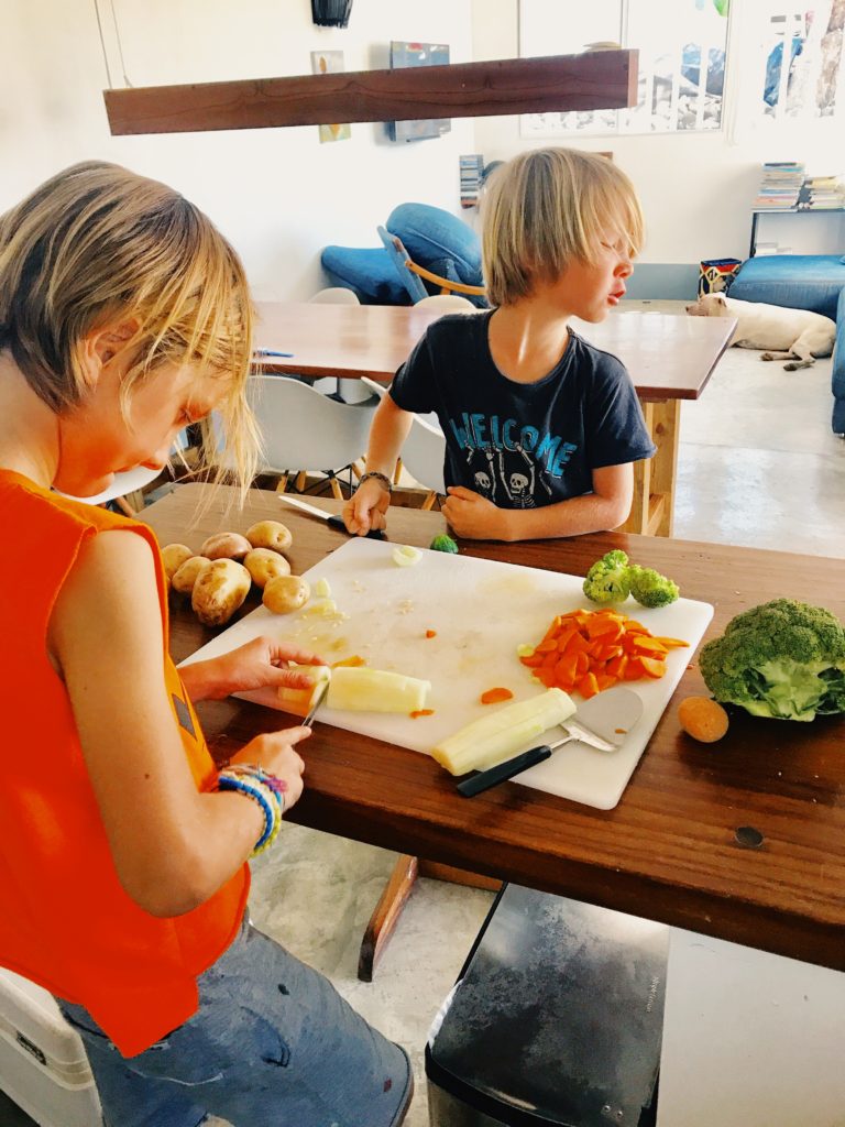 kids helping out in the kitchen; one of the ways to get kids to eat veggies
