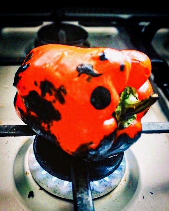 bell pepper roasting on the stovetop