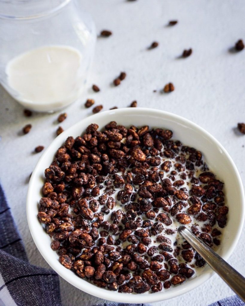 cocoa puffs and milk in background