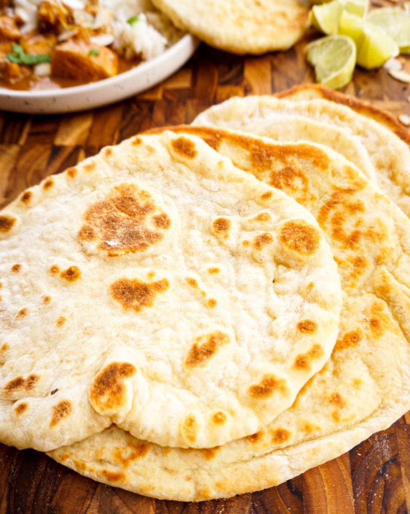 naan breads on cutting board