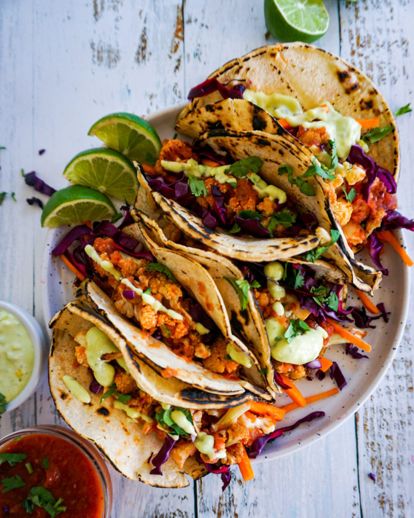 corn tortillas filling with cauliflower and pickled cabbage and carrot