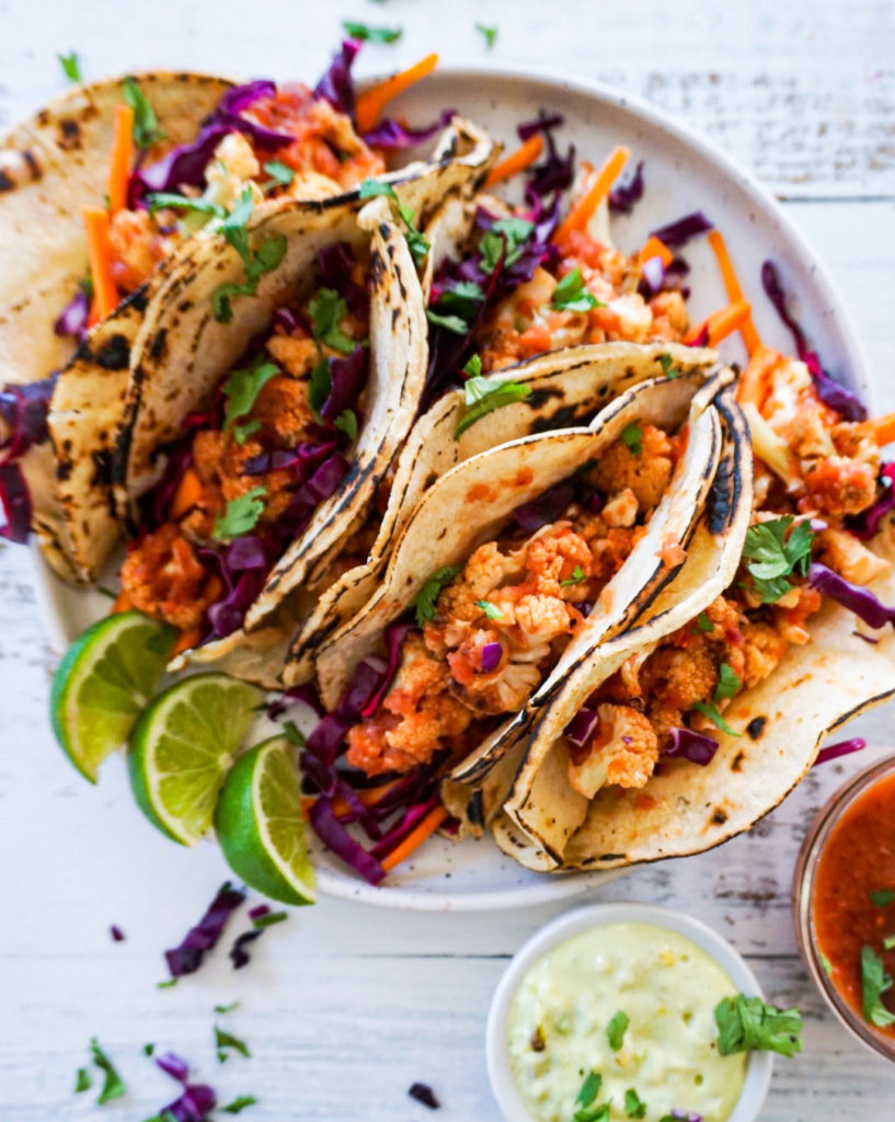 Roasted cauliflower tinga tacos with avo crema - by Familicious