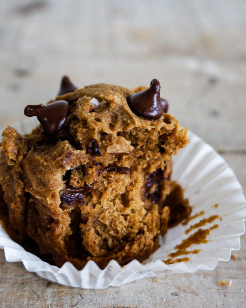 close up of a muffin with a bite taken