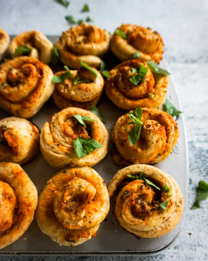 close up pizza buns with fresh basil