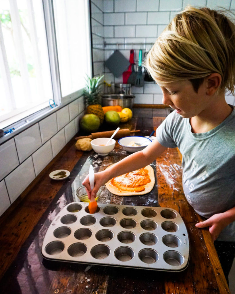 greasing the muffin tin