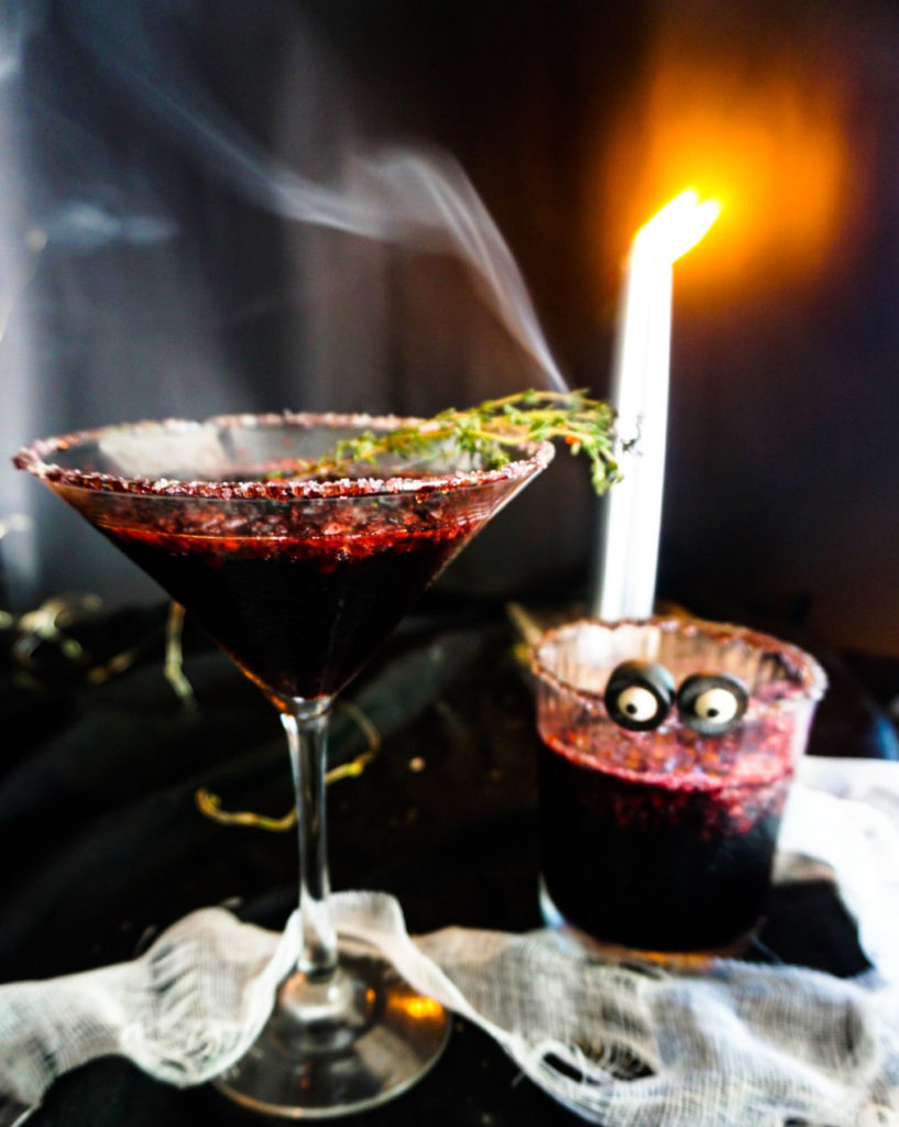 The Morticia, a Halloween's cocktail made with muddled blackberries and champagne