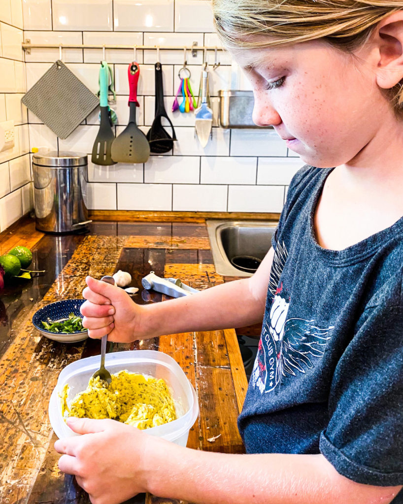 Cooper mixing garlic butter ingredients
