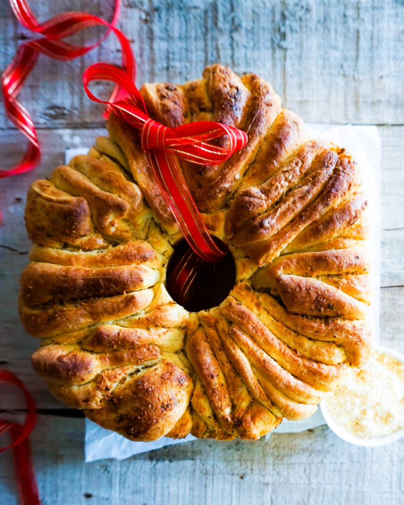 Garlic herb bread wreath with a Christmas bow