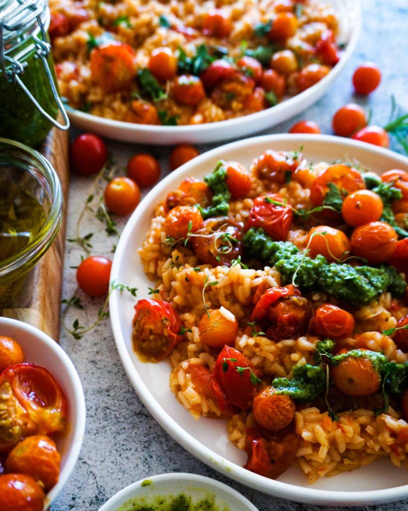 roasted cherry tomato risotto with peppermint pesto divided over 2 plates