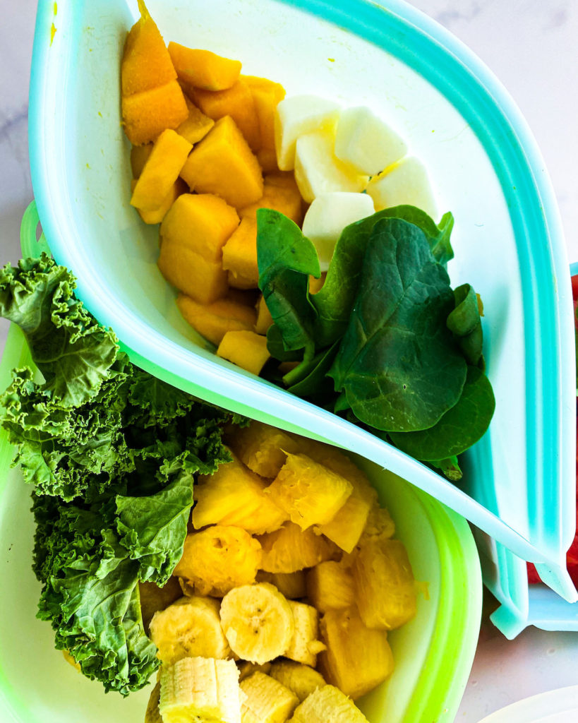 close up of different freezer bags filled with fruit and veggies