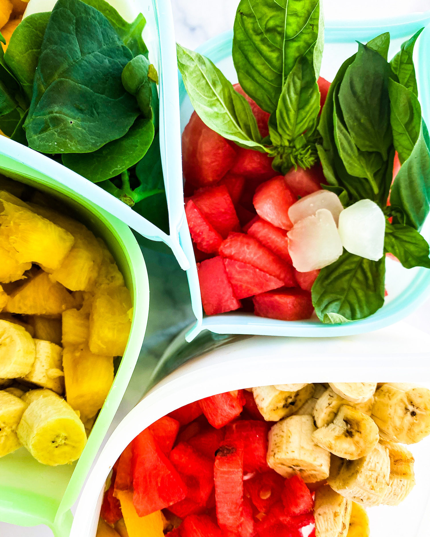 different freezer bags filled with fruit and veggies