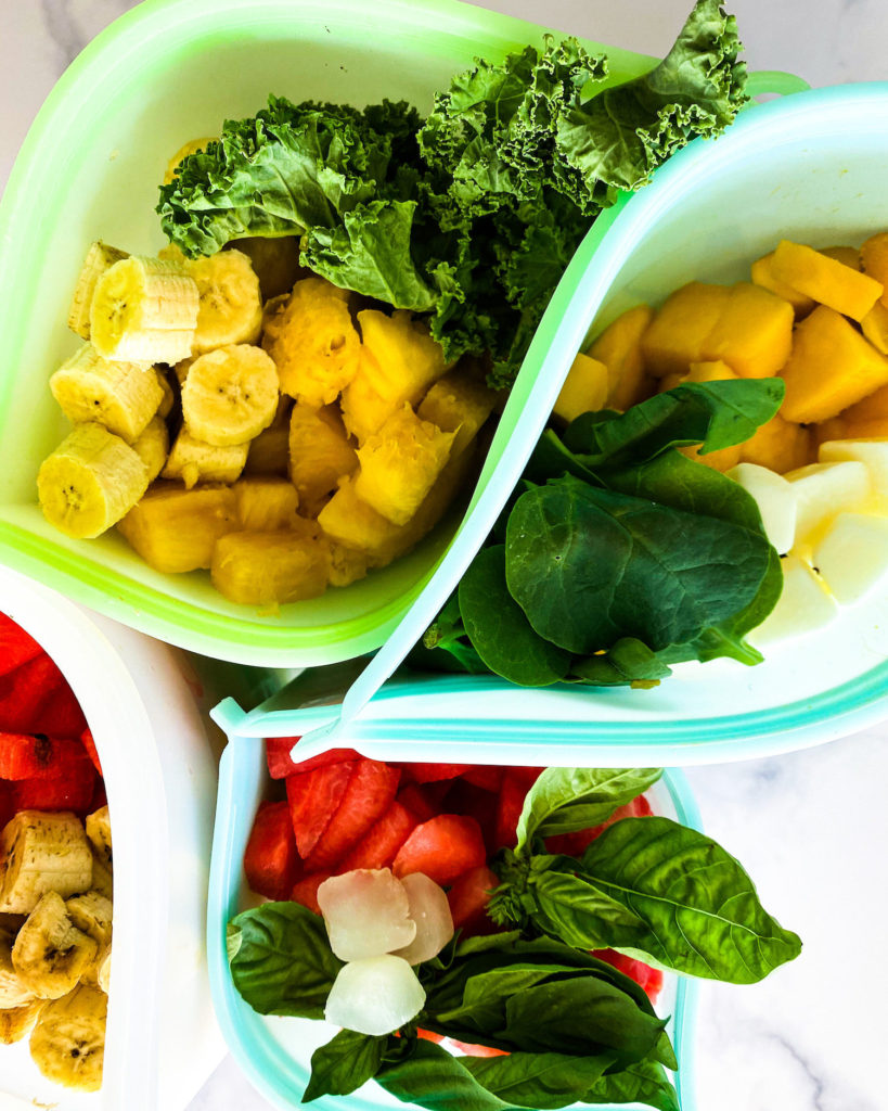 different freezer bags filled with fruit and veggies