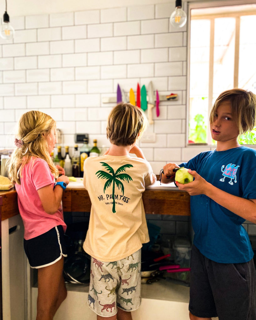 Kids peeling apples for apple pie