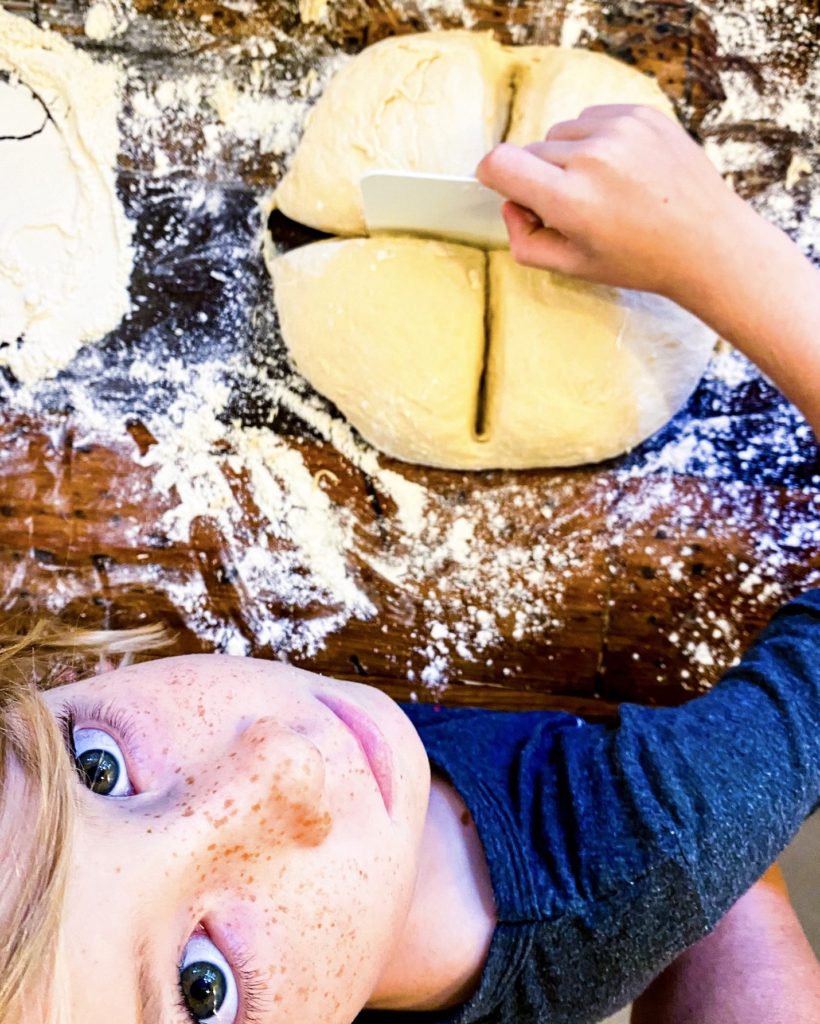 Cooper cutting dough in 4 pieces