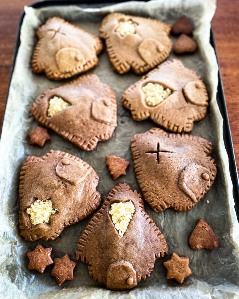 gingerbread house cookies on a baking tray