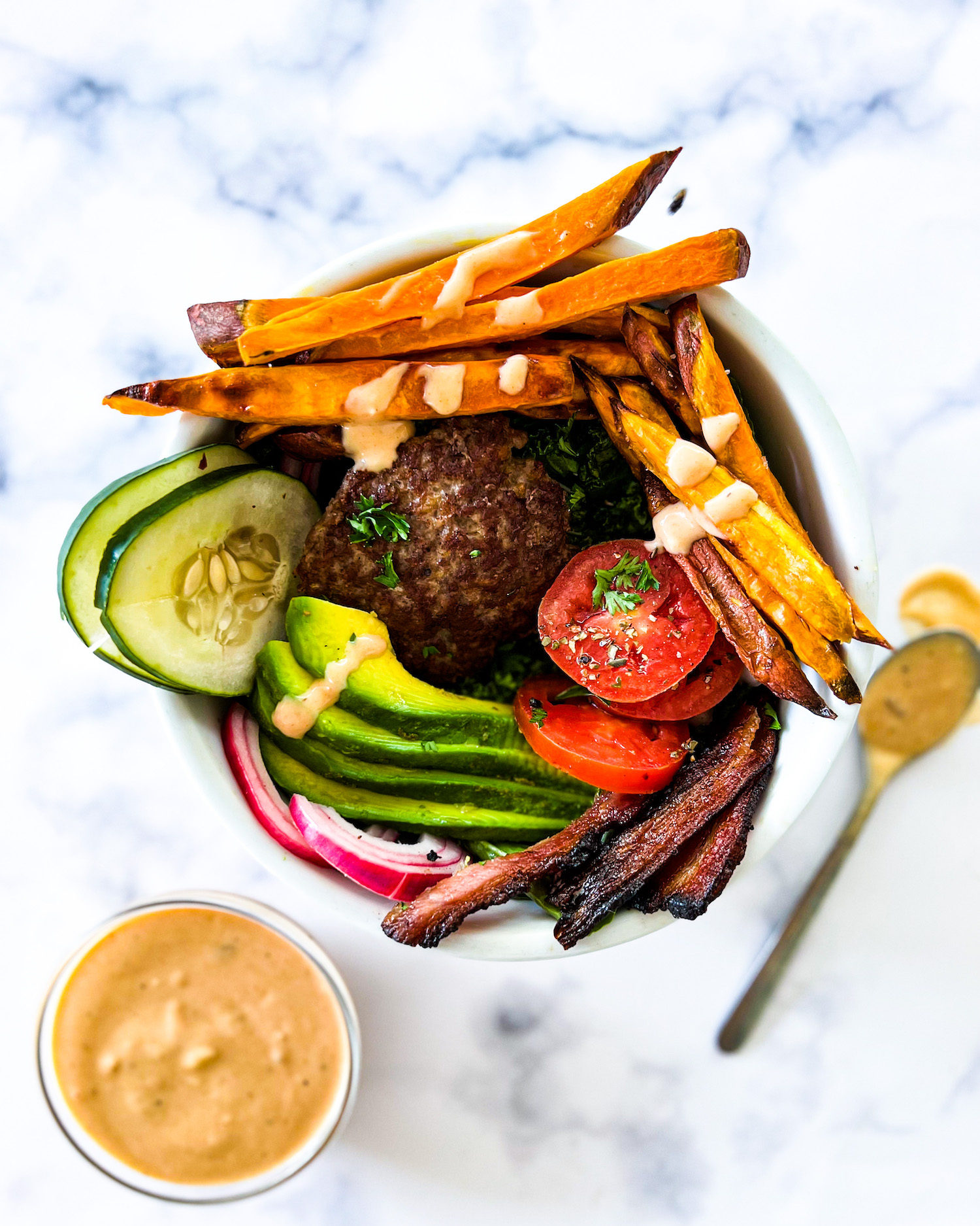 burger, fries and garnishing on top of lettuce