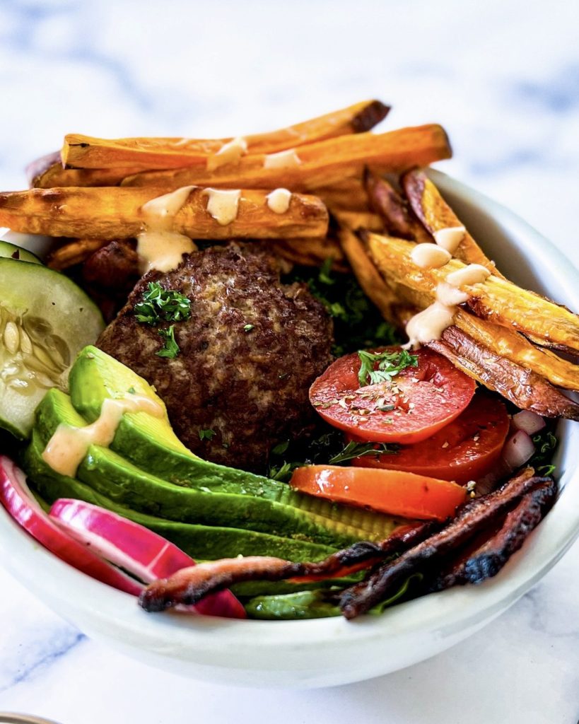 burger, fries and garnishing on top of lettuce