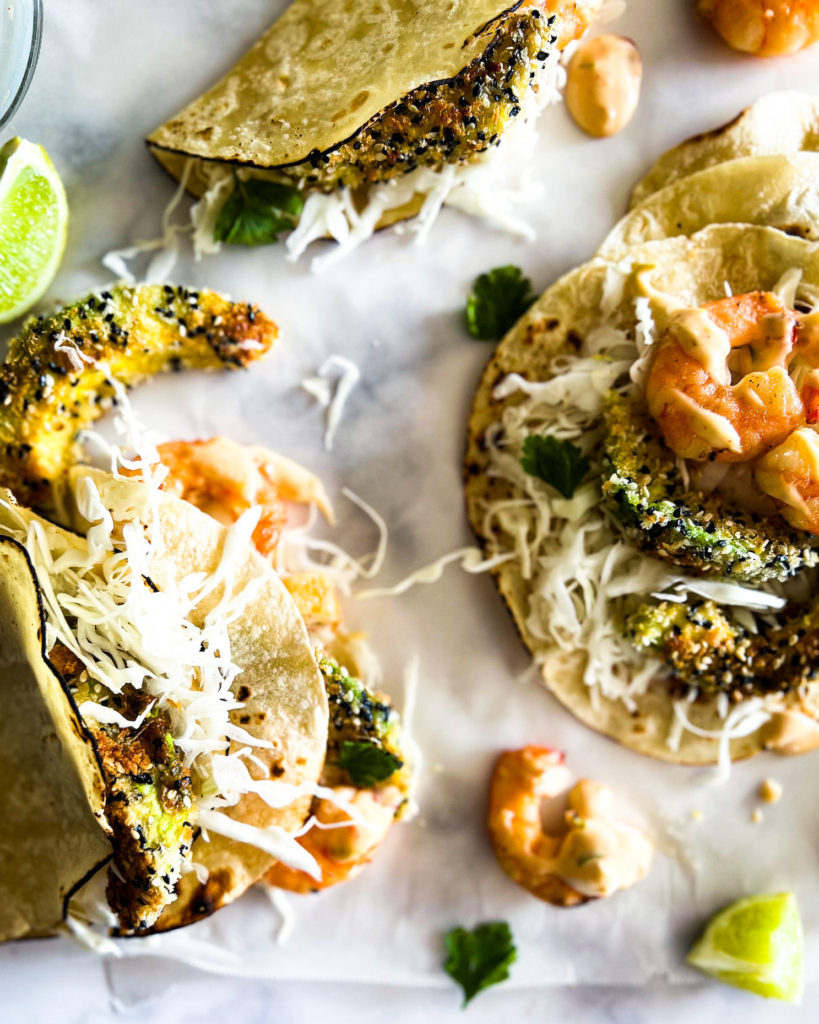 Sesame panfried avocado and shrimp tacos close up