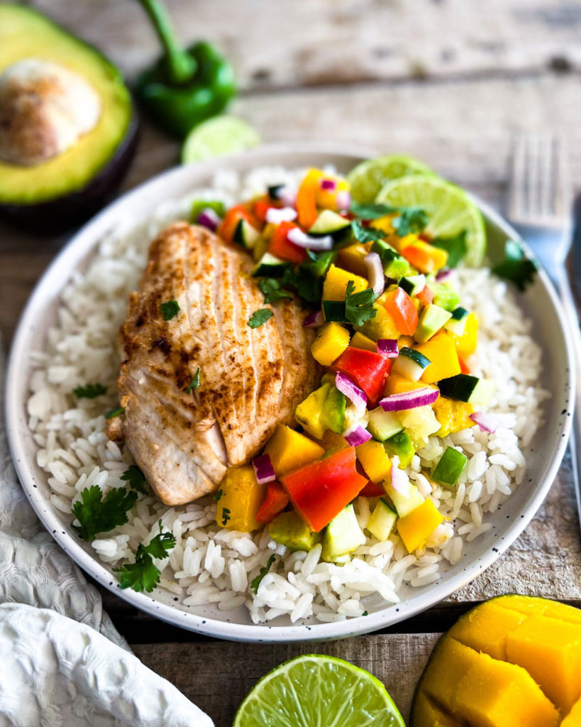 a plate of citrus cilantro fish filets with mango salsa up close