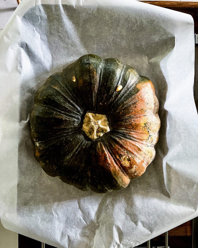 Half of a pumpkin ready for roasting