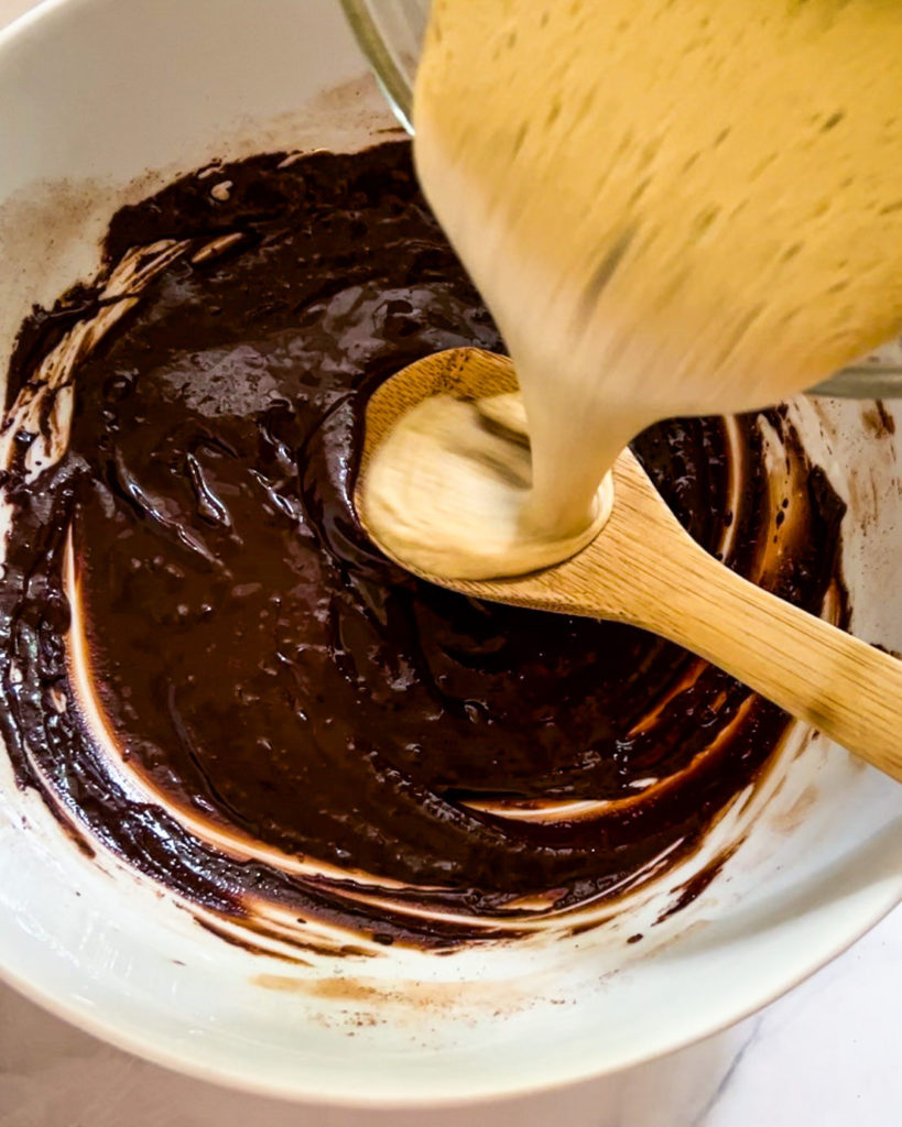 Pouring the foamy eggs into the brownie batter
