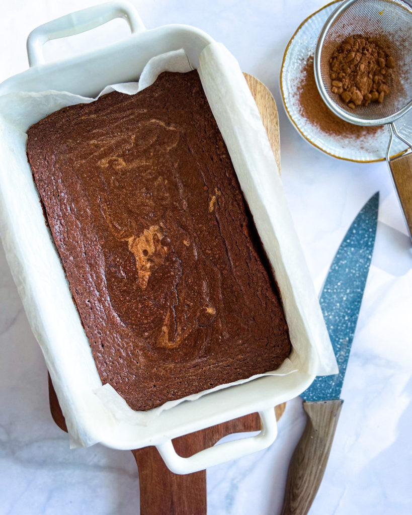 brownies in baking pan ready to be cut