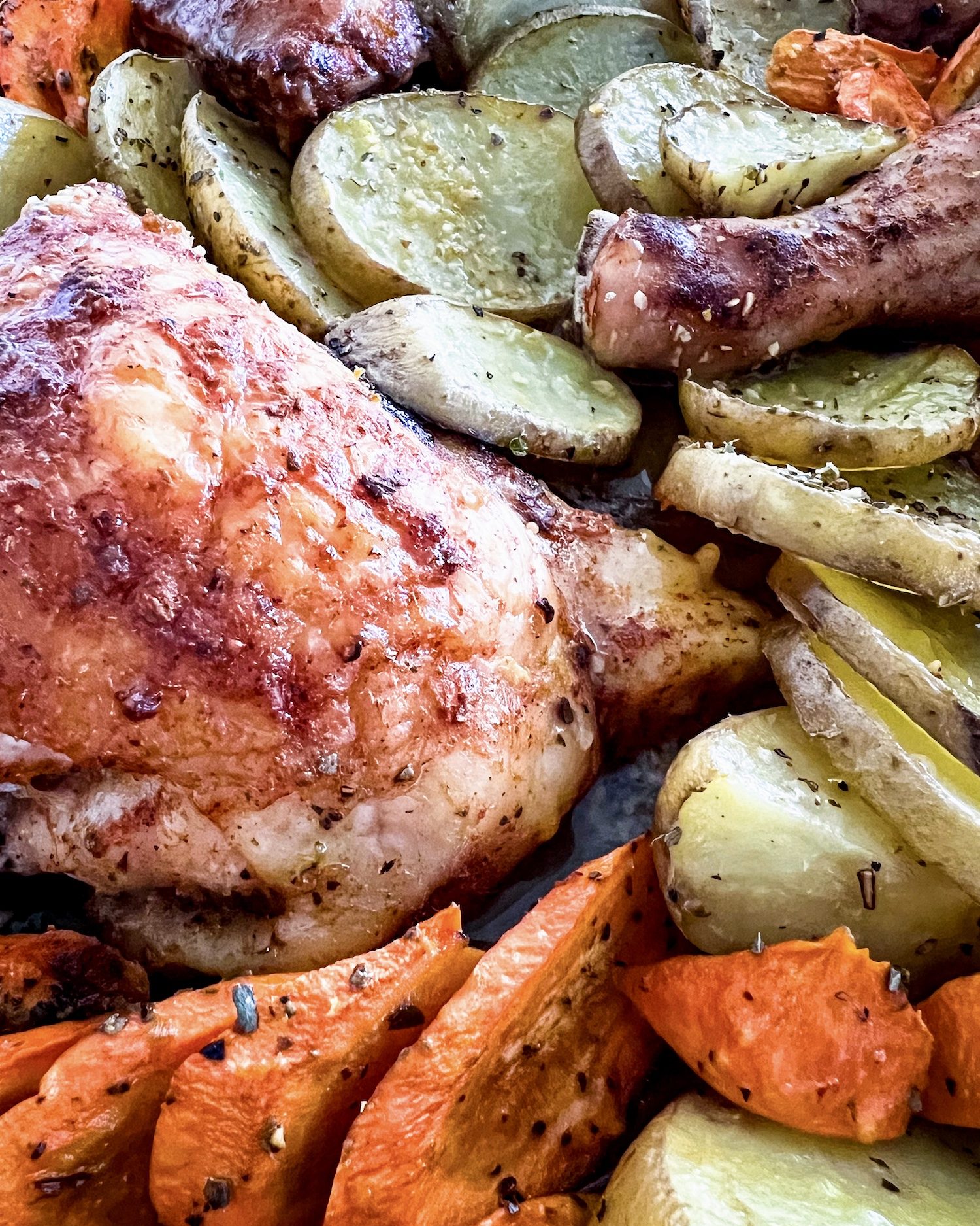 lemon baked chicken and potatoes close up