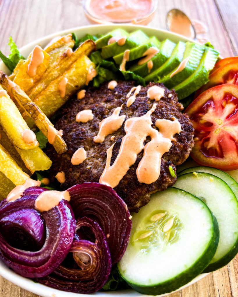 burger and fries bowl with burger sauce close up