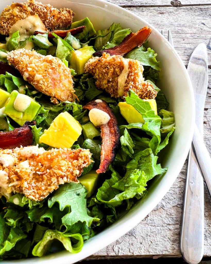 chicken finger salad in a bowl lose up