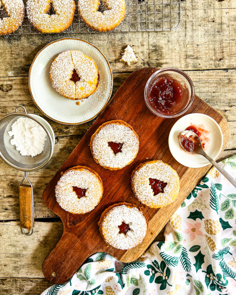 linzer cookies filled with raspberry jam and dusted with powdered sugar