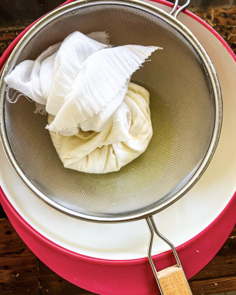 yogurt straining in cheese cloth
