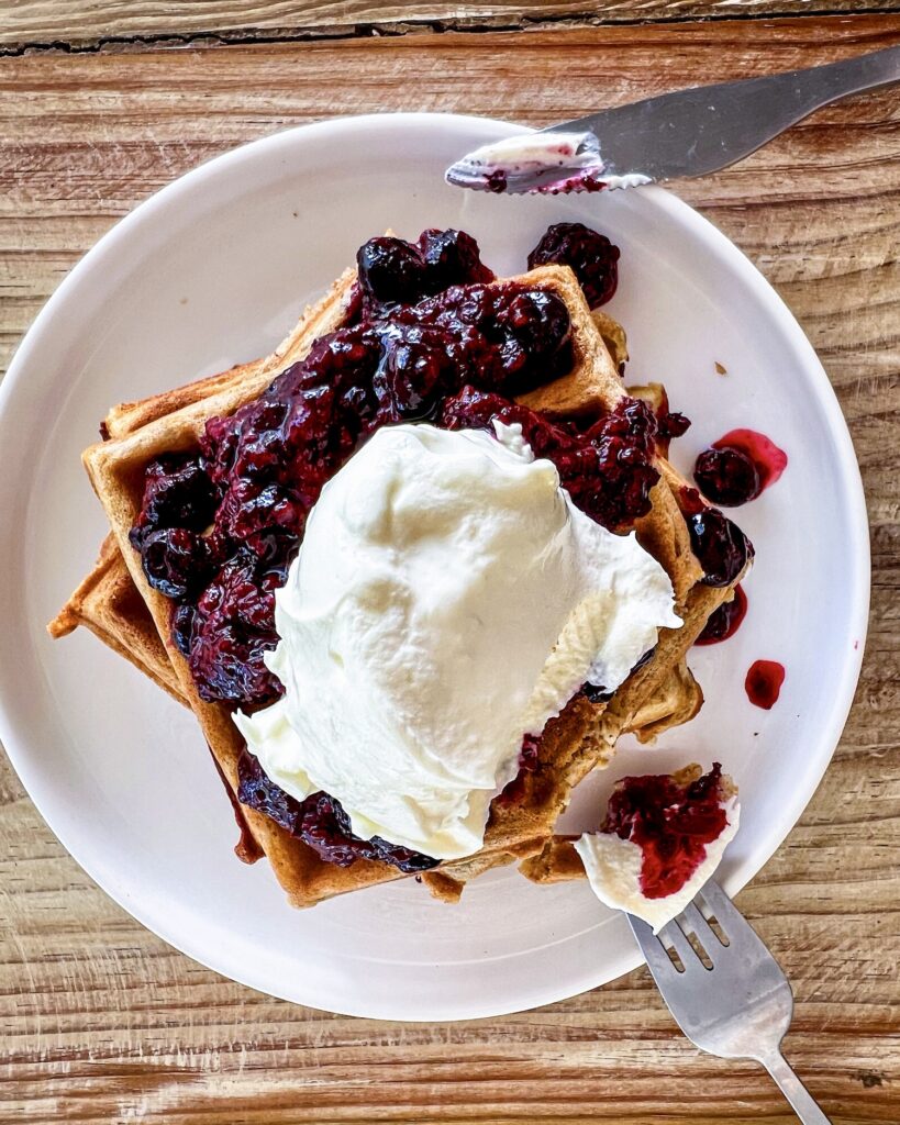 stack of waffles with berry compote and labneh