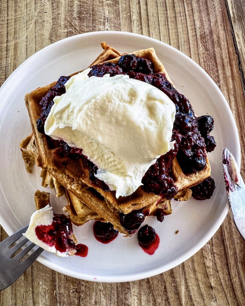 stack of waffles with berry compote and labneh